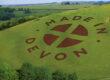 A field with made in devon's logo on it